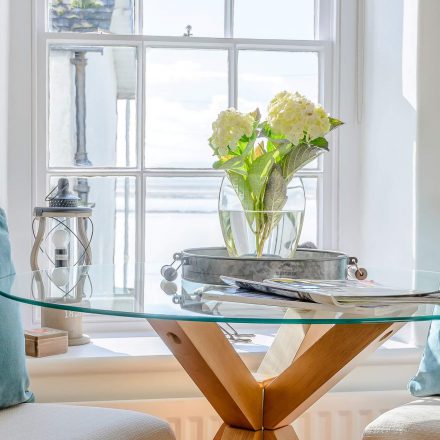 Living room round glass table in Tegfan holiday cottage, Aberdyfi