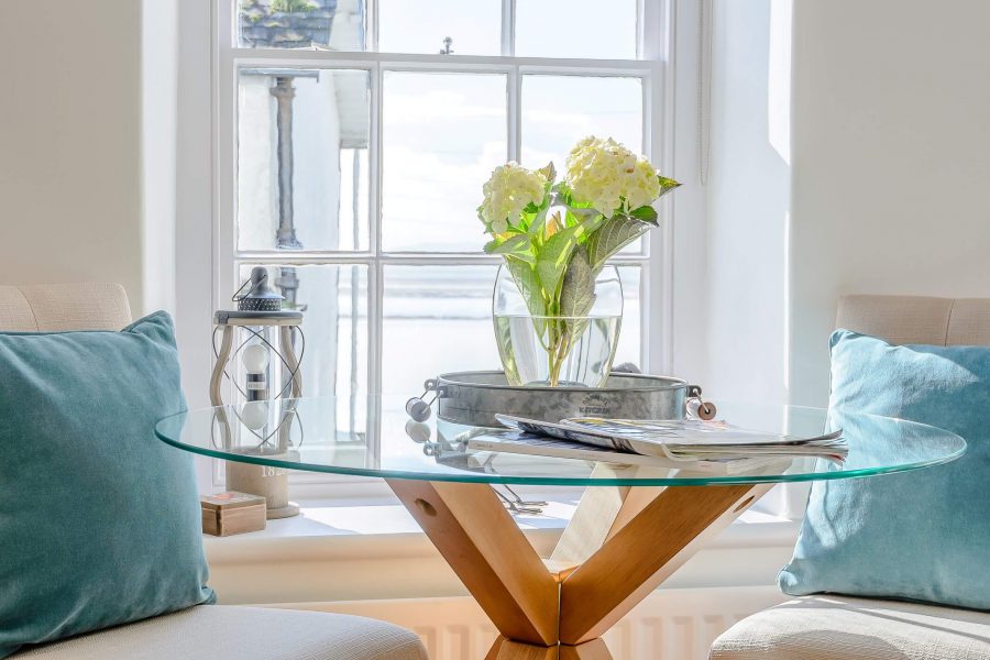 Living room round glass table in Tegfan holiday cottage, Aberdyfi