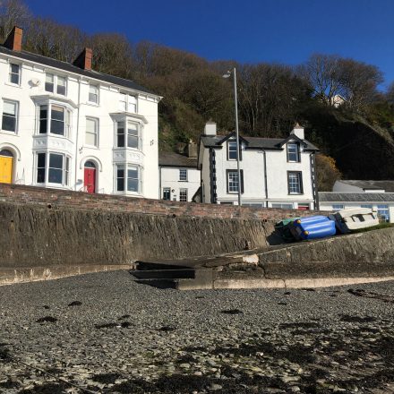 Looking up at Aberdyfi sea front from the beach